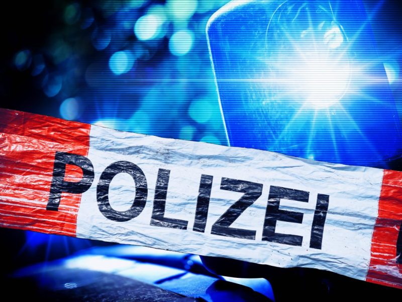 Polizei Absperrband und Blaulicht